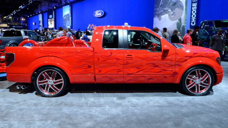 Illustration for article titled This Awesome F-150 With Flames On It Comes With A Matching Chopper Bicycle
